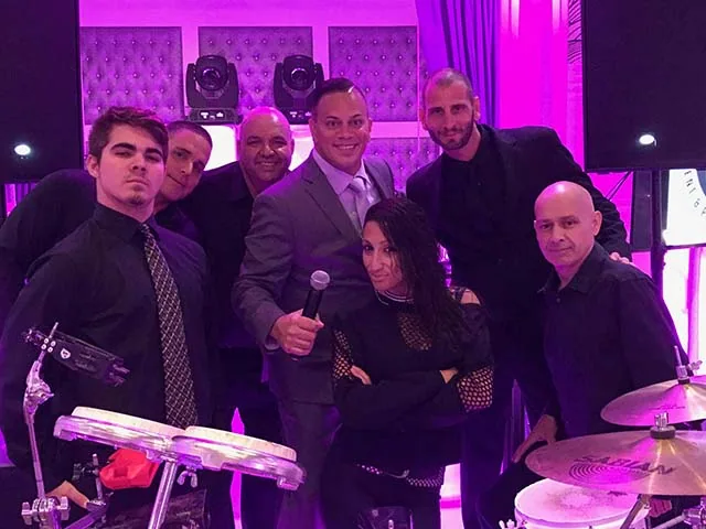 The Play it Again crew with guests at a party