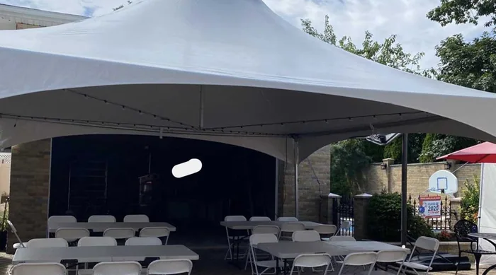 Tent shading a patio with seating