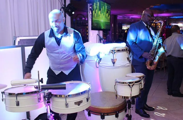 Live percussion and saxophone alongside the DJ