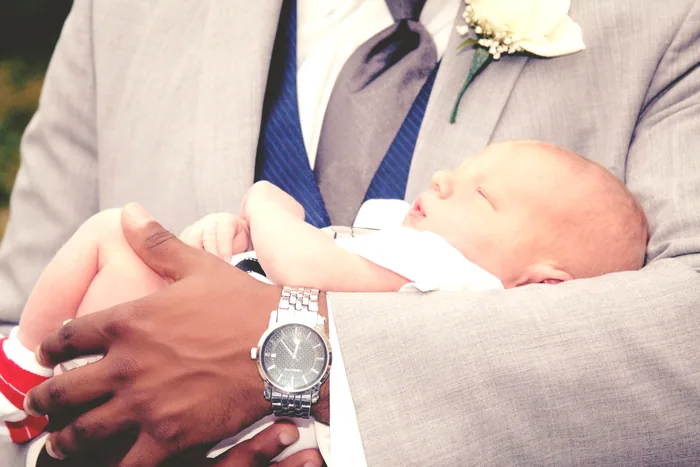 Baby held at a baptism celebration